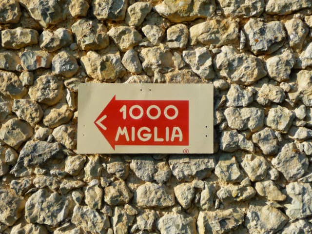 Mille Miglia sign on a wall in Italy.Join us on our tour to watch the 2018 Mille Miglia  